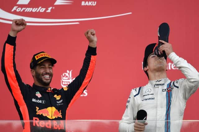 Winner Daniel Ricciardo and third placed William' driver Lance Stroll celebrate on the podium. Picture: Getty.