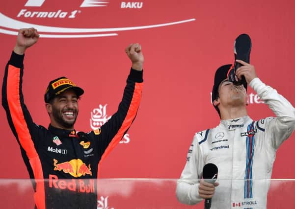 Winner Daniel Ricciardo and third placed William' driver Lance Stroll celebrate on the podium. Picture: Getty.