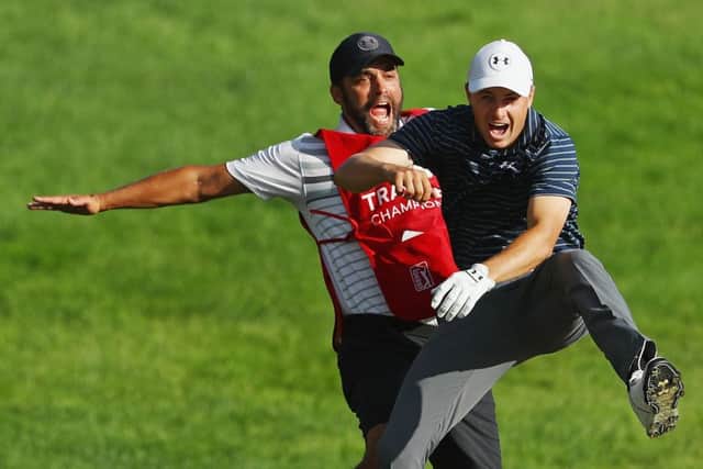 Jordan Spieth and caddie Michael Greller celebrate after his holed bunker shot in the Travelers Championship. Picture: Getty Images