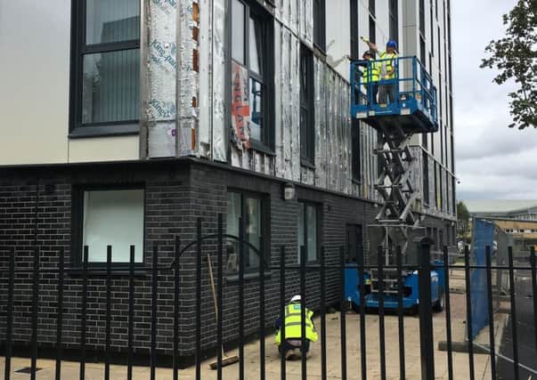 Cladding being removed from one of nine high rise blocks in Salford. Picture: PA