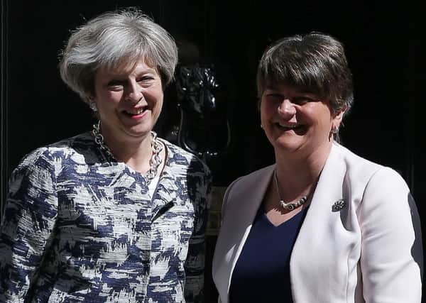 Britain's Prime Minister Theresa May (L) poses for a picture with Democratic Unionist Party (DUP) leader Arlene Foster at 10 Downing Street. Picture: DANIEL LEAL-OLIVAS/AFP/Getty Images