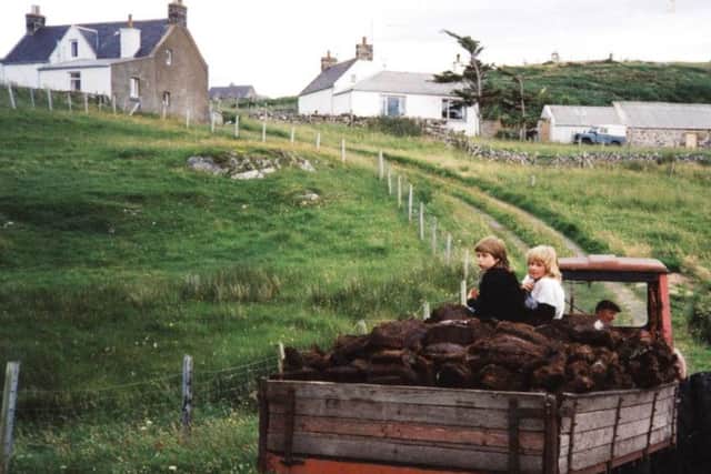 Tractors were later used to transport peat - but its collection was alwasy a family affair. PIC: Strathnaver Museum.