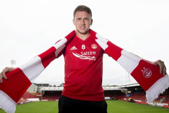 Greg Stewart dons his new colours yesterday after signing a loan deal at Aberdeen.