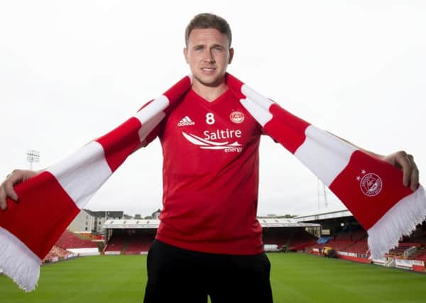 Greg Stewart dons his new colours yesterday after signing a loan deal at Aberdeen.