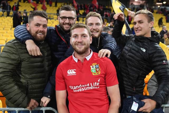 Finn Russell joins a group of friends following his Lions appearance yesterday, but his debut was a brief one. Picture: David Gibson/Fotosport.