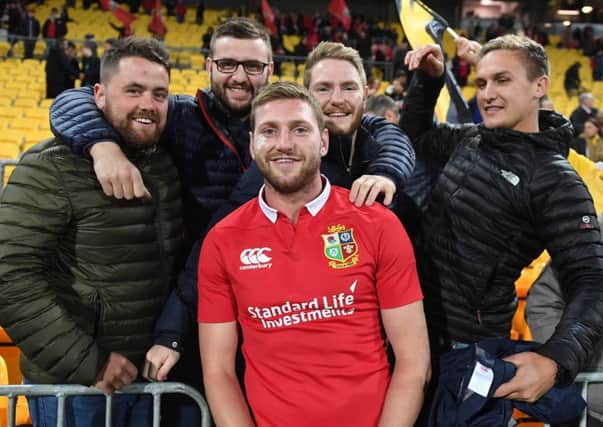 Finn Russell joins a group of friends following his Lions appearance yesterday, but his debut was a brief one. Picture: David Gibson/Fotosport.