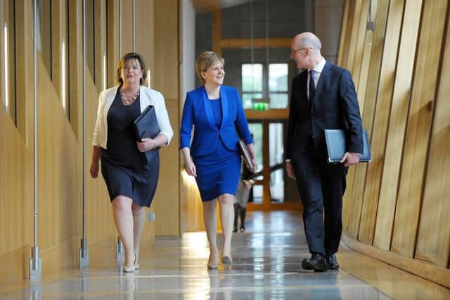 First Minister Nicola Sturgeon, with Fiona Hyslop MSP and Deputy First Minister John Swinney, prepares to inform the Scottish Parliament of her revised position on a second independence referendum. Picture: Getty Images