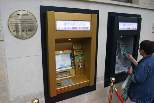 A gold-coloured ATM outside a branch of Barclays in London marks the 50th anniversary of the UK's first cash machine.
 Picture: Daniel Leal-Olivas/AFP/Getty Images