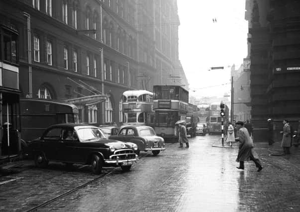 Glasgow traffic in Central Station area.  Trams and cars causing congestion in the 1950s. Picture: TSPL