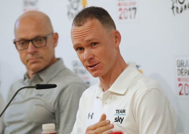 Chris Froome, right, and Sky team manager Sir Dave Brailsford during a press conference in Dusseldorf Picture: Christophe Ena/AP