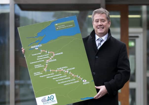 Economy secretary Keith Brown displays the A9 sections due to be dualled by 2025. Picture: Janes Barlow
