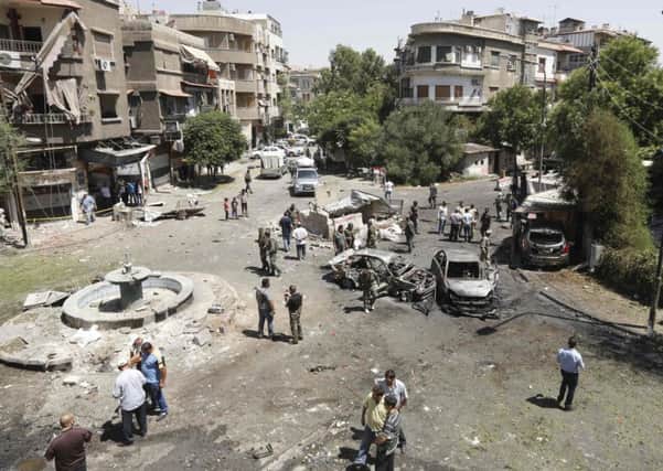 A suicide bomber detonated his explosives after being surrounded by security officers in the Tahrir Square district of Damascus yesterday. Picture: AP