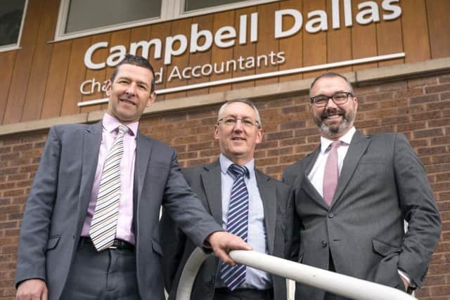 From left: Andy Ritchie, Charlie Carnegie and Chris Horne outside Campbell Dallas' new Perth office. Picture: Jakub Iwanicki