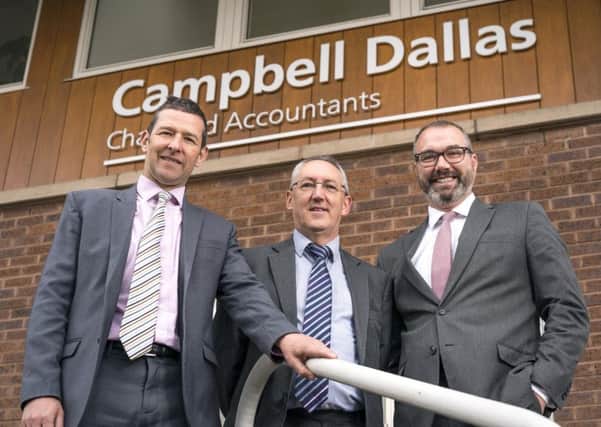 From left: Andy Ritchie, Charlie Carnegie and Chris Horne outside Campbell Dallas' new Perth office. Picture: Jakub Iwanicki