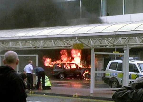 Flames rise from a jeep after the terrorist car bomb attack on Glasgow Airport in 2007. Picture: PA