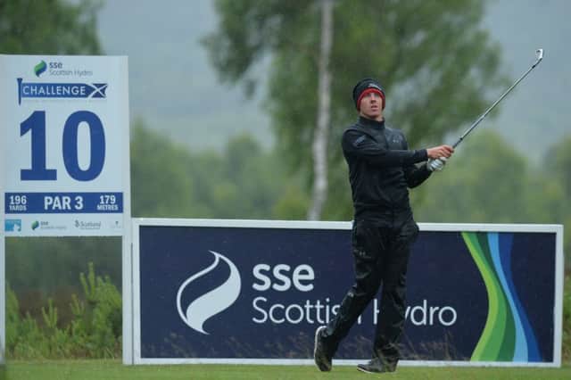 Grant Forrest watches his tee shot at the 10th in the opening round of the SSE Scottish Hydro Challenge in Aviemore. Picture: Marc Runnacles/Getty Images