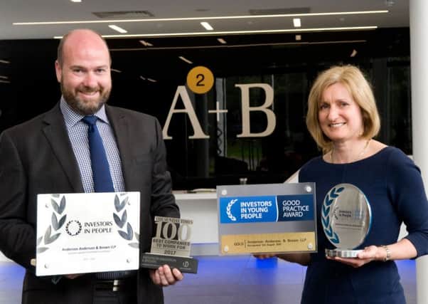AAB's Graeme Allan and Karen Stewart with the firm's Investors in People awards. Picture: Contributed