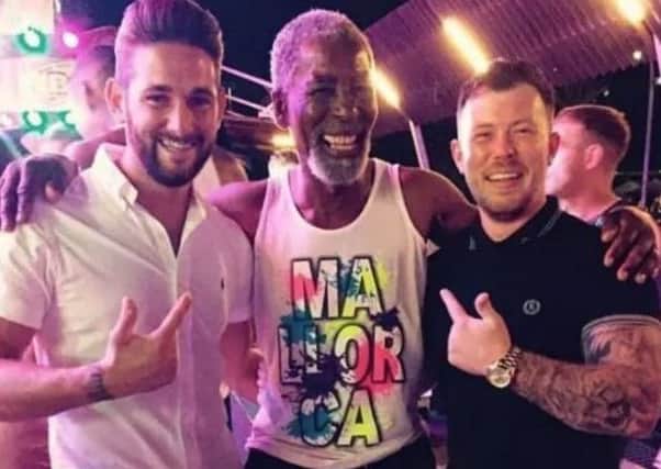 Norman pictured with Magaluf party goers. Picture: Luton Today/Twitter