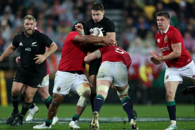 New Zealand's Beauden Barrett is tackled by British and Irish Lions' Mako Vunipola (left) and Alun Wyn Jones. Picture: David Davies/PA Wire.