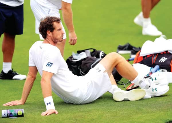Andy Murray takes a break at the Wimbledon practice courts yesterday. Picture: Adam Davy/PA