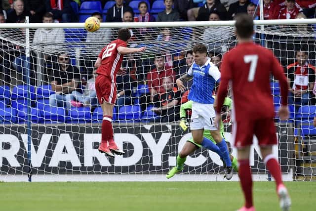 Ryan Christie rises to head home Aberdeens second goal in their 3-0 victory. Picture: SNS.