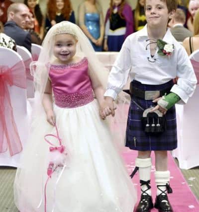Eileidh Paterson, 5, and best friend Harrison Grier, 6, both from Forres, Moray, at their 'wedding' ceremony in at the AECC, Aberdeen. Picture: SWNS