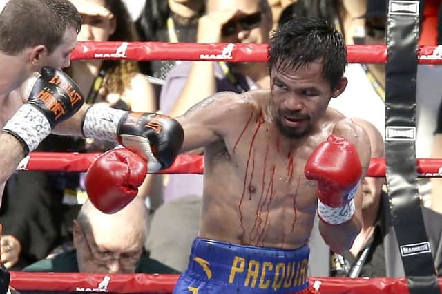 Manny Pacquiao, right, of the Philippines and Jeff Horn, left, of Australia, during their WBO World welterweight title bout in Brisbane. Picture: Tertius Pickard/AP