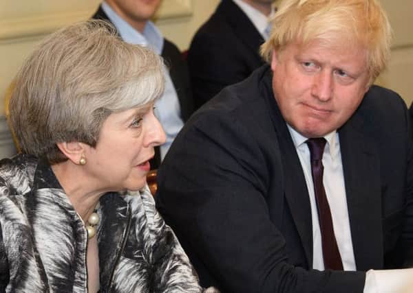 Boris Johnson backs May's Brexit plan "100%" despite claims he could welcome an easing up on the Prime Minister's "red lines" for negotiations. Picutre: PA