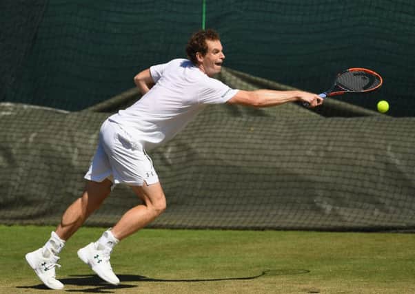 Andy Murray is at full stretch during a practice session at Wimbledon on Sunday. Picture: Shaun Botterill/Getty Images