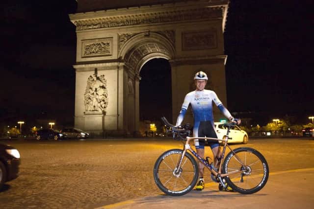 Mark Beaumont, 34, set off from under the Arc de Triomphe in Paris, France, on his attempt to reclaim the world record for circumnavigating the globe. Picture: PA