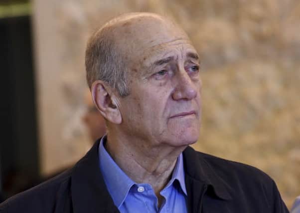 Former Israeli Prime Minister Ehud Olmert leaves the courtroom of the Supreme Court after the court ruled on his appeal in the Holyland corruption case in Jerusalem. Picture: AP