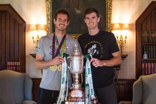 Murray with brother Jamie and the Scottish Cup. Picture: Contributed/Hibernian FC