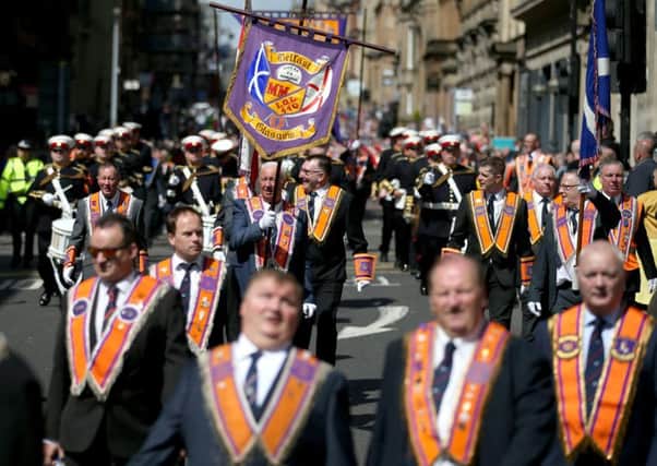 Thousands took to the street in Glasgow to take part in Orange Walks. Picture: Jane Barlow/PA Wire