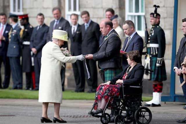 Queen Elizabeth II receives the keys from Edinburgh's Lord Provost Frank Ross. Picture: Jane Barlow/PA Wire