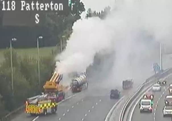 Fire crews rushed to the scene to extinguish the fire. Picture: Traffic Scotland