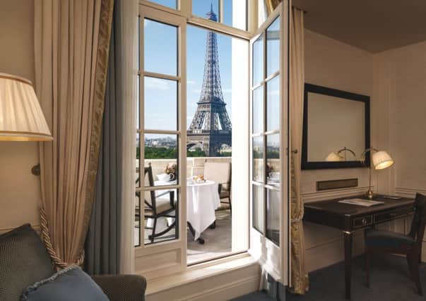 The view of the Eiffel Tower from a bedroom balcony at the Shangri La hotel