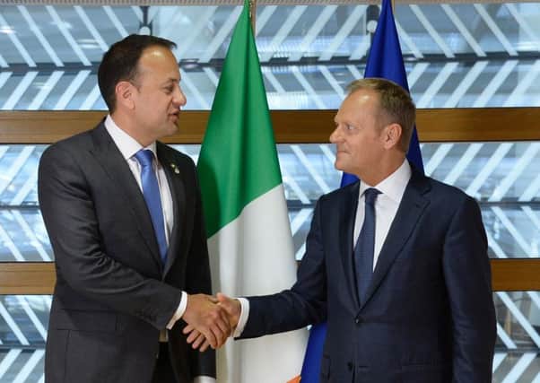Ireland's Prime Minister Leo Varadkar (L) shakes hands with President of the European Council Donald Tusk. (Photo credit should read THIERRY CHARLIER/AFP/Getty Images)