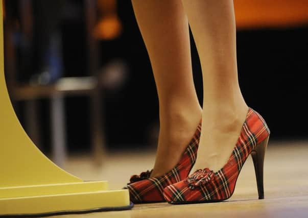 Nicola Sturgeons tartan high heels exemplify power dressing. Picture: Greg Macvean