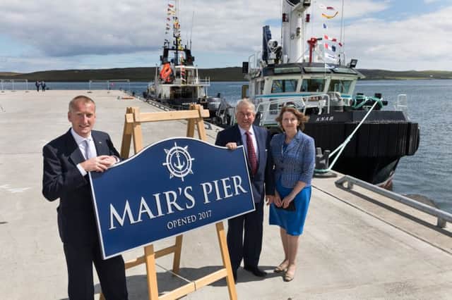 Shetland MSP Tavish Scott (left) officially names the new Mairs Pier in Lerwick this week with harbour authority chairman Brian Anderson and chief executive Sandra Laurenson. Picture: John Couts