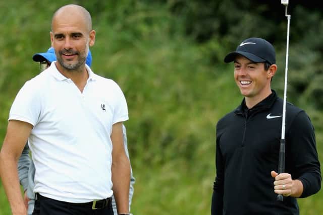 Pep Guardiolla stands with Rory Mcilroy on the 8th green during the Pro-Am of the Dubai Duty Free Irish Open at Portstewart Golf Club.  Picture: Warren Little/Getty Images