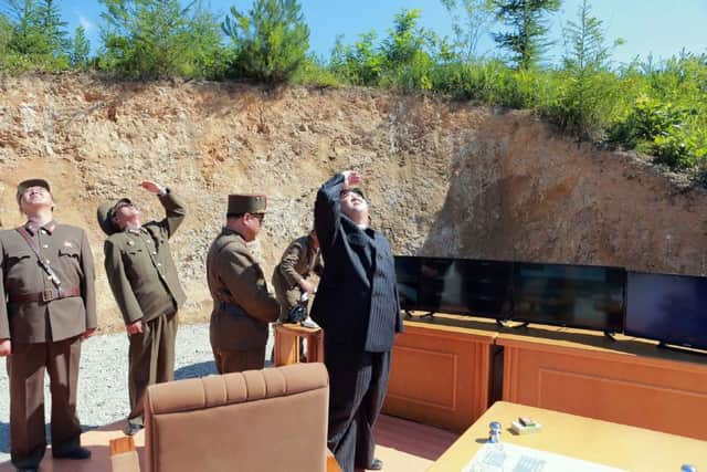 This picture taken on July 4, 2017 and released by North Korea's official Korean Central News Agency (KCNA) on July 5, 2017 shows North Korean leader Kim Jong-Un (R) inspecting the successful test-fire of the intercontinental ballistic missile Hwasong-14 at an undisclosed location.
South Korea and the United States fired off missiles on July 5 simulating a precision strike against North Korea's leadership, in response to a landmark ICBM test described by Kim Jong-Un as a gift to "American bastards". / AFP PHOTO / KCNA VIA KNS / STR / South Korea OUT / REPUBLIC OF KOREA OUT   ---EDITORS NOTE--- RESTRICTED TO EDITORIAL USE - MANDATORY CREDIT "AFP PHOTO/KCNA VIA KNS" - NO MARKETING NO ADVERTISING CAMPAIGNS - DISTRIBUTED AS A SERVICE TO CLIENTS
THIS PICTURE WAS MADE AVAILABLE BY A THIRD PARTY. AFP CAN NOT INDEPENDENTLY VERIFY THE AUTHENTICITY, LOCATION, DATE AND CONTENT OF THIS IMAGE. THIS PHOTO IS DISTRIBUTED EXACTLY AS RECEIVED BY AFP. 

 / STR/AFP/Getty Images