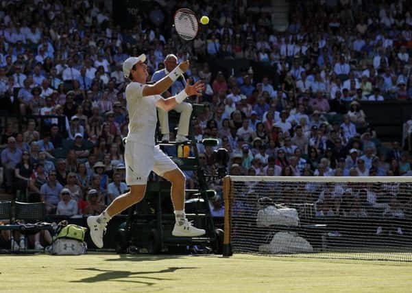 Andy Murray returns against Germany's Dustin Brown. Picture: Adrian Dennis/AFP/Getty Images