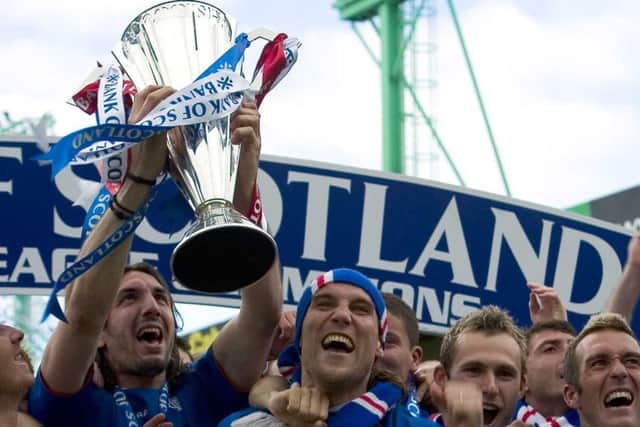 Rangers players celebrate clinching the league title in 2005. Picture: Bill Murray/SNS