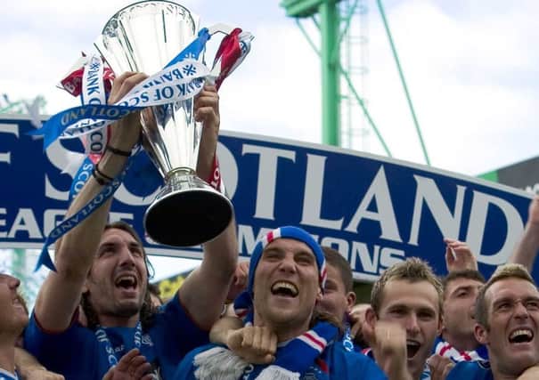 Rangers players celebrate clinching the league title in 2005. Picture: Bill Murray/SNS
