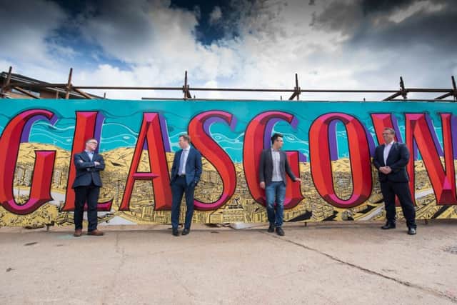 Entrepreneurial Scotland chief 
Sandy Kennedy with 
David Mitchell of Deloitte, SWG3's Andrew Fleming Brown and Jamie Grant of Barclays. Picture: Graeme Hunter