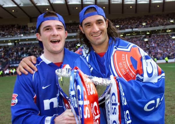 Barry Ferguson (left) and Rangers team-mate Lorenzo Amoruso after the 2002 CIS Cup final. Picture: SNS