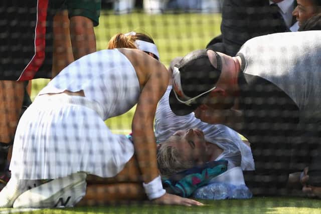 Bethanie Mattek-Sands receives treatment for a serious knee injury during her second round match against Sorana Cirstea of Romania.  Picture: David Ramos/Getty Images