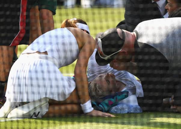 Bethanie Mattek-Sands receives treatment for a serious knee injury during her second round match against Sorana Cirstea of Romania.  Picture: David Ramos/Getty Images