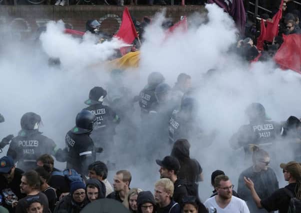 Anti-riot police try to restore order as protesters take a stand against the G20 summit in Hamburg. Picture: AP