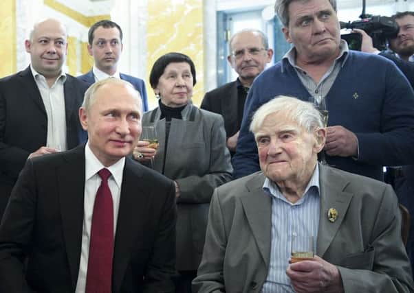Russian President Vladimir Putin, left, and famous Russian writer Daniil Granin, 98,. Picture:  Alexei Druzhinin/Pool File  via AP